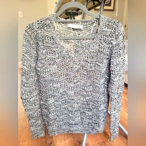 Black and white V-neck sweater